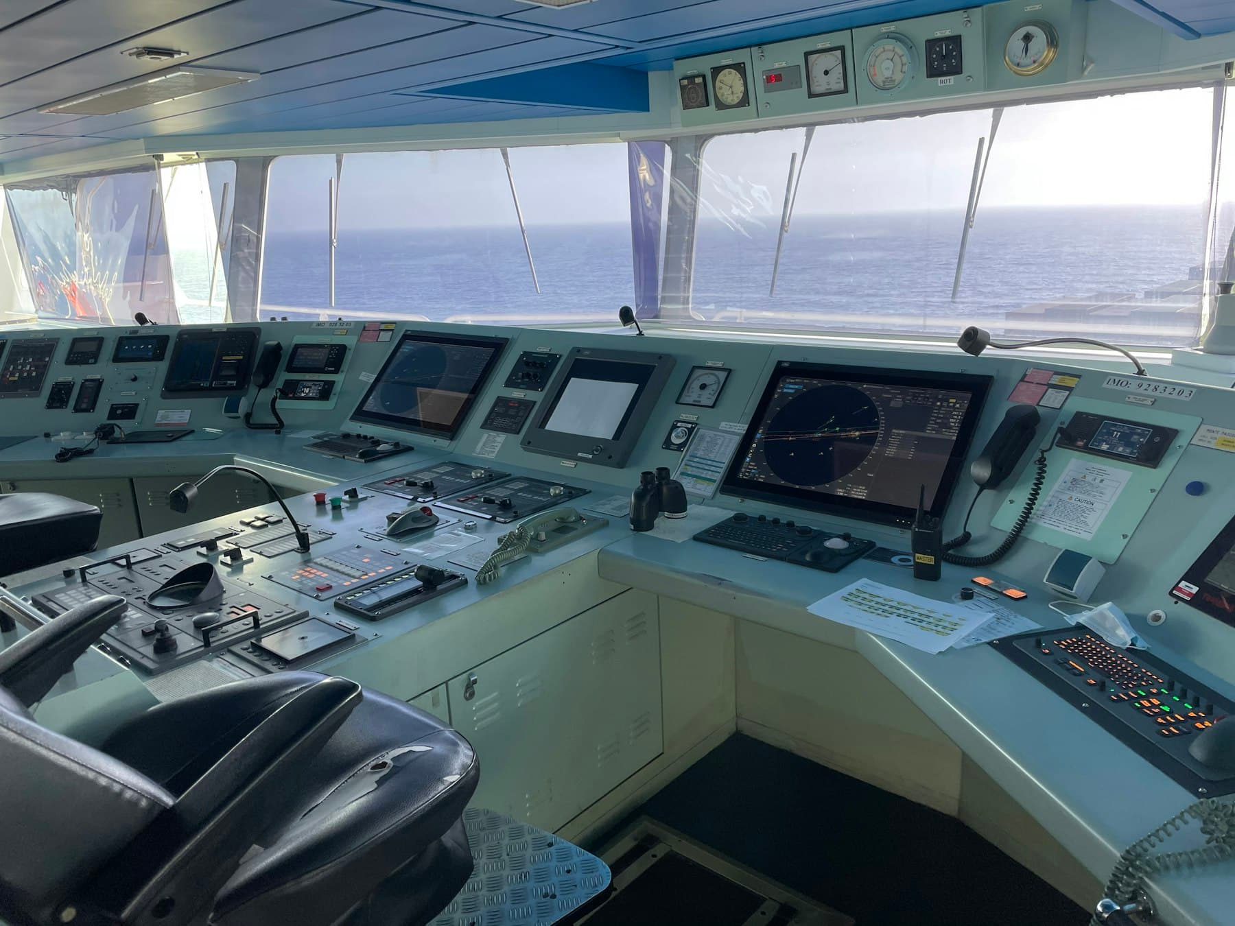 Navigational bridge of a ship, looking out over the sea.